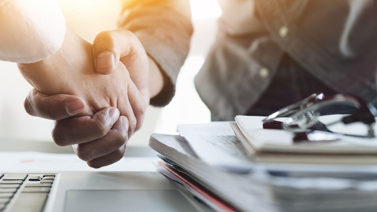 Close up of two people shaking hands